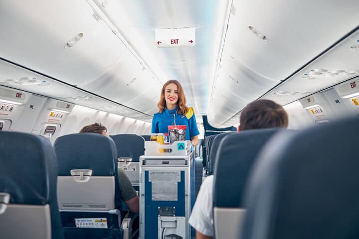 Flight Attendants in 2025 vs 1950's Stewardesses Photo