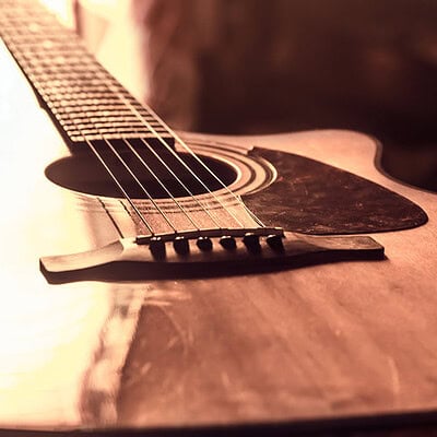 Bone, Plastic, or Graphite? Choosing the Ideal Saddle for Your Guitar Photo