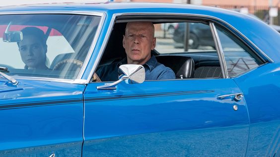 Bruce Willis in a famous muscle car.