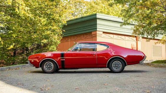 The Oldsmobile in red.